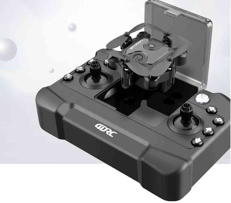 Mini folding drone stored inside its dedicated remote control case for easy transport.