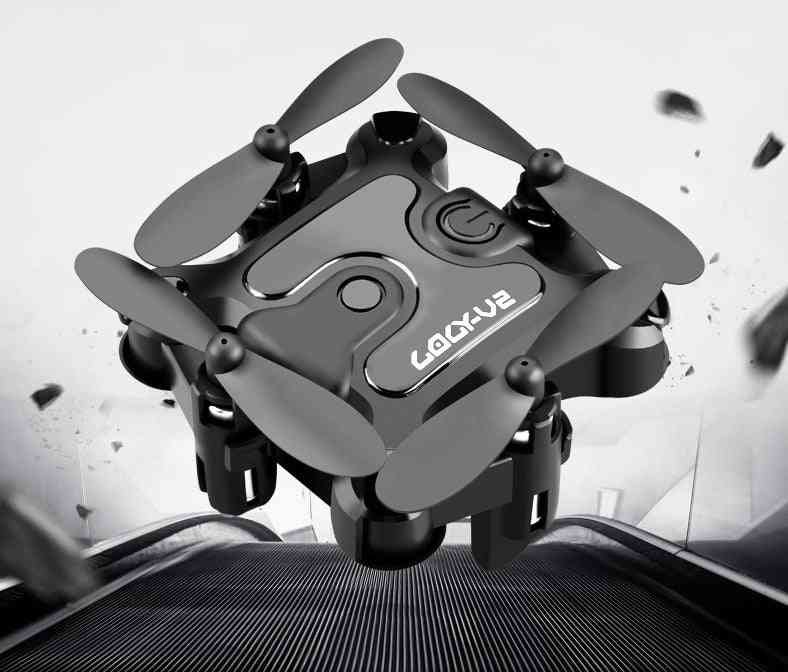 Foldable mini drone with durable design, compact structure, and protective propeller guards.