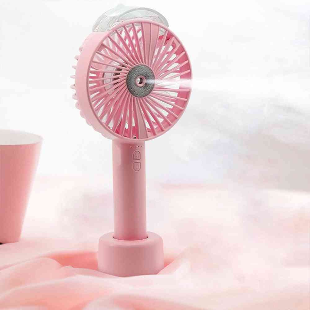 Pink USB handheld fan with misting function, perfect for on-the-go cooling. Features a rechargeable 1200MAH battery and lightweight design.