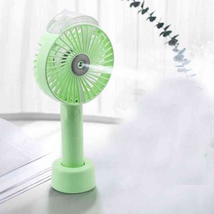 USB handheld fan in pastel green with a misting feature, lightweight and portable. Ideal for personal cooling with a rechargeable 1200MAH battery.