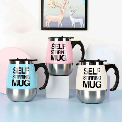 Set of three self-stirring electric coffee mugs in stainless steel with pink, blue, and white accents, featuring ergonomic handles and bold text design.