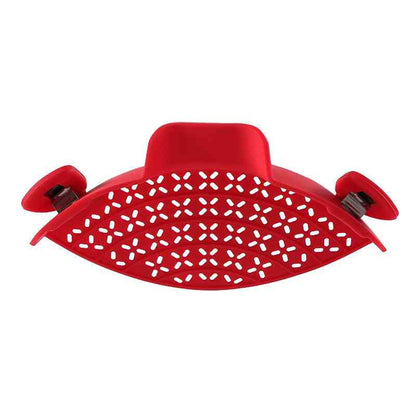 Red silicone pot side drain with a perforated design and secure clips, perfect for easy and controlled liquid pouring.