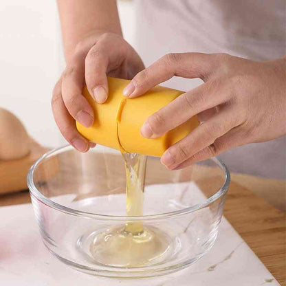 Yellow egg opener in action, cracking an egg cleanly over a bowl. Designed for effortless egg separation without shell fragments.