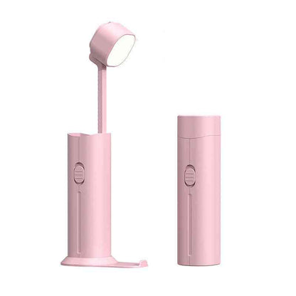 Pink multifunctional table lamp featuring an LED light, USB charging port, and compact design. Perfect for bedside or desk use.